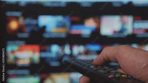 smart tv. online video streaming service. with apps and hand. Male hand holding remote the control turn off smart tv . man hand lifestyle controls holding remote. concept internet online cinema