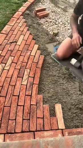 Installing Red Brick Garden Path with Sand Base for a Durable and Aesthetic Walkway