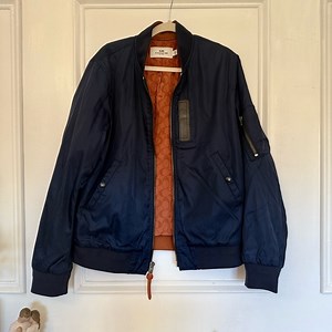 Coach Navy Bomber Jacket with Vibrant Orange Interior