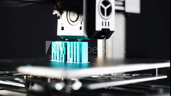 Close view of 3D printer forming a plastic model using new manufacturing technology as part of efficient and automated modern industrial production workflow. High quality 4k footage