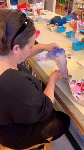 Learning how to embroider.