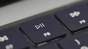 clip-1106151549-person-pressing-play-pause-button-on-laptop