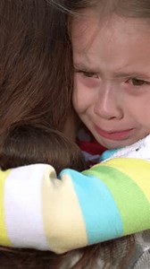 little child cries, tears child face, mother calms capricious kid girl daughter, happy family, wipe tears face, hug kid park, child defeat, tantrums, children tears, don't cry, children bad behavior