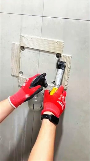 Power tool cuts tile, wall opening takes shape