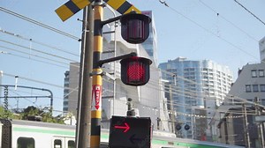 A railroad crossing lamp that signals the passing of a train.
