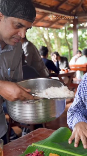 🔥 SADYA SNEAK PEEK! 🔥 You HAVE to see this 18-item feast! This is a quick look at the popular 18-item Kerala Sadya at the famous 1980’s Restaurant in Kalpetta, Wayanad. This massive Nadan Cuisine spread only costs ₹140! 🤯 The preview includes a glimpse of the delicious Prawn Fry and the warming Mutton Pepper Fry! Watch the FULL Story and Review Now! 👇 https://youtu.be/ArtPI7KzVeY Link in bio and story! | Kripal Amanna