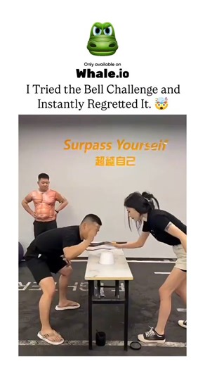 Unviversal Clips on Instagram: "The Instagram reel features a 108-second video from a Chinese gym showcasing the "Bell Challenge," a viral social media trend where participants attempt to lasso a cup on a table using a jump rope to "ring" it, but failures lead to rope snaps, tumbles, and pain, prompting the caption's regret. Multiple clips depict diverse gym-goers, including muscular men and women in athletic wear, struggling comically amid "Surpass Yourself" motivational banners, emphasizing th