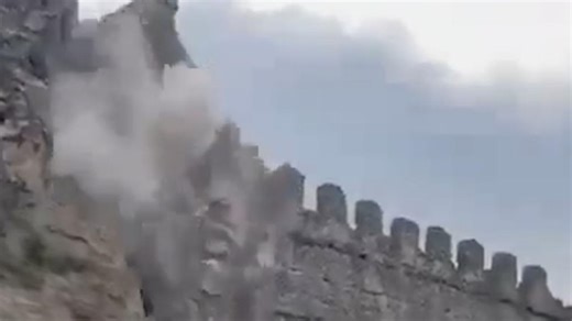 Dramatic moment tourists flee as historic castle collapses