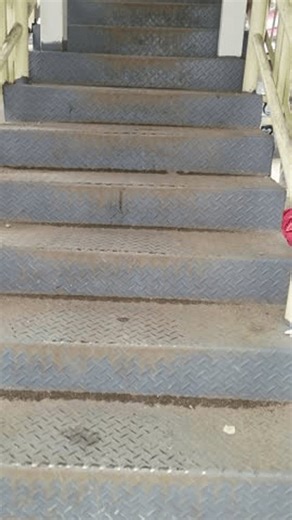 clip-3992388965-steel-pedestrian-overpass-stairs-diamond-plate-texture