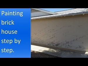 Painting brick house exterior.