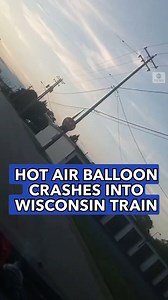 This driver captured the scene as a hot air balloon became entangled with a moving train. Three people suffered injuries when the pilot was forced to make an emergency landing in Burlington, Wisconsin. https://abcn.ws/2Mp6pHp | ABC News