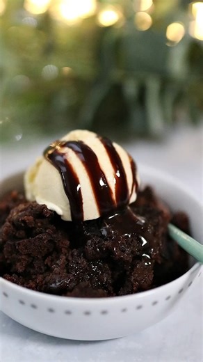 Slow Cooker Chocolate Fudge Cake butter or oil for greasing 200g plain flour 150g sugar 50g chocolate chips 30g cocoa powder 2 tsp baking powder 125g unsalted butter 250ml milk 2 tsp vanilla extract To Top: 250ml boiling water 2 tbsp cocoa powder 2 tbsp sugar Cook on HIGH for 2 hours | My Fussy Eater