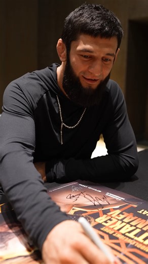 Squiggle with a smile 🤣✍️ Khamzat Chimaev gave Robert Whittaker a makeover on the #UFC308 poster! | UFC