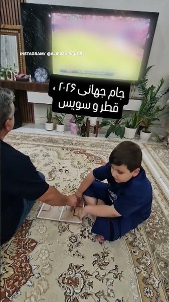Iranian dad helps blind son feel the World Cup