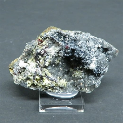 Rod Tyson on Instagram: "Kermesite with Valentinite and Stibnite from La Nicolet Antimony Mine, Ham Sud Tp., Quebec. One of the better pieces from Brad Wilson and Daryl MacFarlane’s work in the mid-1990’s. Tufts of red kermesite and long crystals to 1 cm. (lower left of center) with valentinite crystals to 2mm and micro-stibnite sprays. 5.7 x 3.5 x 2 cm. $225 CAD. Roughly $165USD Jan. 7, 26. Saw cut on back. #kermesite#valentinite#stibnite#lanicoletantimonymine#hamsudtp#quebec#canadianmineralcol