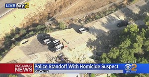 Police standoff with homicide suspect in Downey