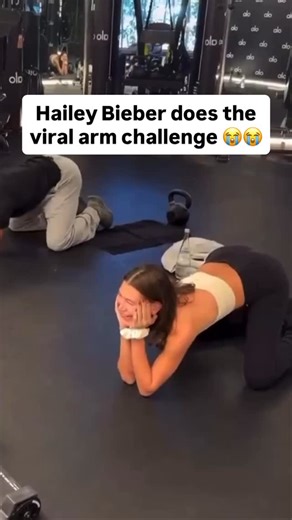 Pop Hive on Instagram: "Hailey Bieber reposted a story from Lauren Perez showing her in an 'arm challenge' at an Alo Yoga studio, which is sparking online chatter. 👀 The video shows Hailey and her trainer, Louis Chandler, competing in a friendly strength contest. The caption reads, ‘Men, they just don’t compare to women.’ The video has gone viral, with comments praising her pose and flexibility, some joking about her arch. 🤣 Either way… it’s impressive🔥"