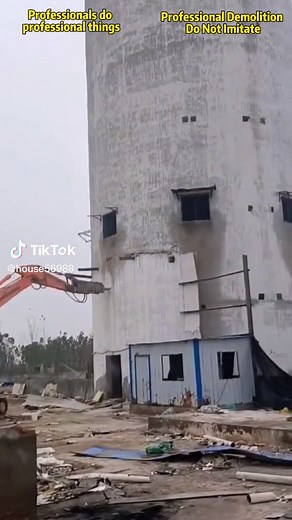 Demolition of Old Building by Excavator
