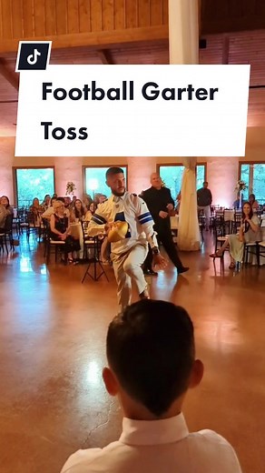 How to do the football garter toss! A groom favorite from the #weddingduo 😁 #tiktokweddingdj #gartertoss #weddingdayfun #weddingdjtips