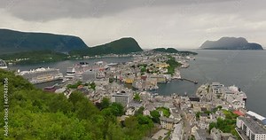 Aalesund tourist town with docked cruise ships on Geirangerfjord, Norway. Drone