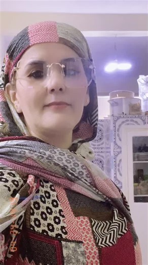 Traditional Shawl Demonstration in a Bright Kitchen