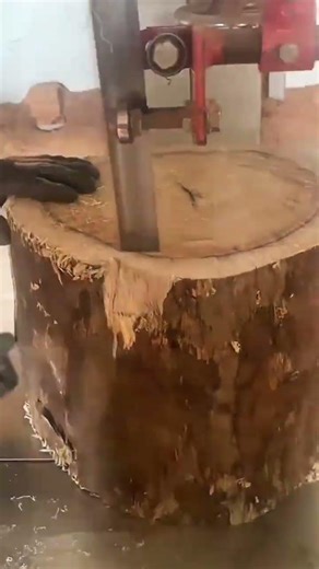 smoothing a wooden furniture surface using a manual sanding tool for