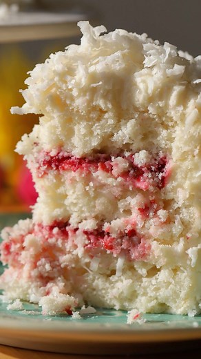 @thefeedfeed on Instagram: "This Coconut Raspberry Cake by @eatatmaudes is a light and fluffy layer cake with raspberry jam filling and cream cheese frosting 🍰 Comment ‘recipe’ to have the details sent to your DMs and keep tagging #feedfeed for a chance to be featured. COCONUT CAKE: Cake flour Baking powder Baking soda Salt Granulated sugar Unsalted butter Unsweetened canned coconut Coconut extract Vanilla extract Egg whites Cream of tartar RASPBERRY FILLING: Fresh raspberries Lemon juice Lemon