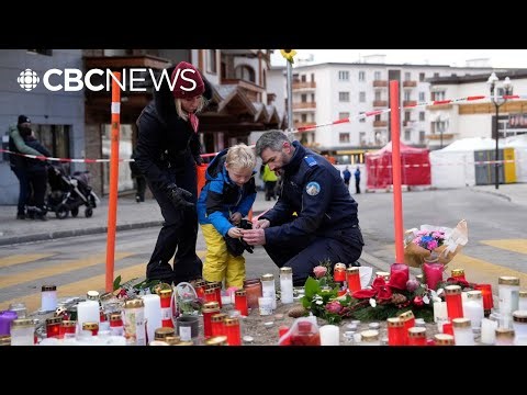 Officials say fountain candles attached to Champagne bottles likely caused Swiss ski resort fire