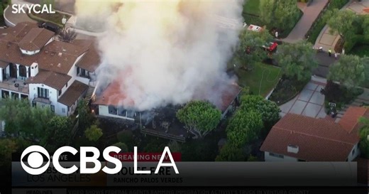 Crews battle a Palos Verdes Estates house fire