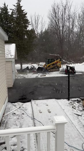Snow Paving with Newly Done Asphalt Driveway