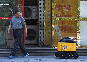 In China, yellow robots deliver snacks to your home