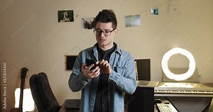 technology blogger influencer recording smartphone review in front of camera