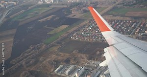 The Ob River and residential quarters in the form of a circle. The city of Novosibirsk. Video shooting through the window of the aircraft. Hand held. Siberia.