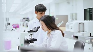 clip-1052138509-two-medical-scientist-working-laboratory--young