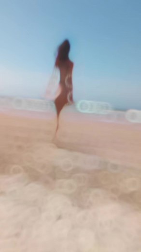 Woman Running on Sunny Beach: Embrace the Ocean