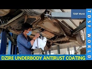 Applying underbody antitrust coating in Dzire at maruti service centre