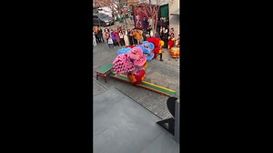 Four performers balance atop giant ball during lion dance in Beijing, China