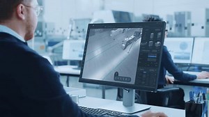 High-tech Factory Office: Industrial Design Engineer Uses 3D CAD Software to Render Autonomous Robot Arm Facility. Product Design Future Manufacturing Processes on Advanced Conveyor Assembly Line