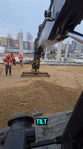 This excavator runs an Engcon tiltrotator with a wide grading beam, making precise leveling smooth and controlled. | Dojo Studio