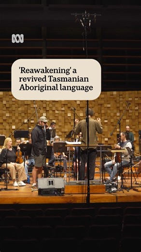 Aboriginal artist Dewayne Everettsmith is collaborating with the Tasmanian Symphony Orchestra on a new album and concert series featuring the palawa kani language. The plan is to premiere the songs with a performance on country for the Tasmanian Aboriginal community next year. Concerts for schools and the public will take place across the state in 2027, with the potential to also go further afield. 🎥 By Jano Gibson via ABC News Tasmania. Personalise your news and stay in the know with the ABC N