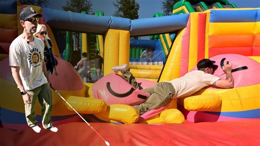 Blind man takes on the world's biggest bounce house: Hilarious adventures inside the fun box!