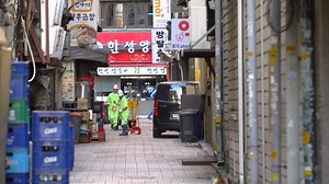 Free stock video - Street cleaners working in back street