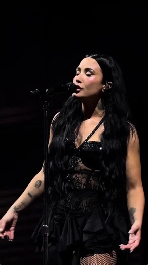 Demi Lovato holds back laughter after a fan attempts a high note, then casually delivers flawless vocals singing ‘Ghost’.