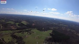 A group of U.S. Army Rangers, assigned to the 5th Ranger Training Battalion, conducts an airborne jump out of a CH-47 Chinook. | The National Desk - TND