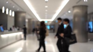 Download People Walking in Hotel Lobby Near Reception Desk During Daytime for free