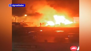 Firefighters battle fire in row of stores in Passaic