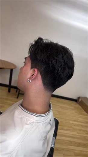 Korean 2 block haircut, styled with a middle part