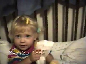 1992 May 25 Heather 2 years old changing her baby doll's diaper