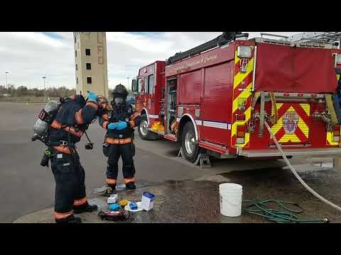 Loveland Fire Rescue Authority firefighters demonstrate decontamination process used after fire