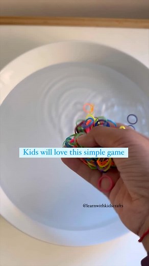 Nisha Yadav| Your Key to Easy Learning Activities on Instagram: "Ready for some exciting fun while practicing fine motor skills? Try this super simple fishing game! All you need is a tray, water and some rubber band. It’s a great way to strengthen hand muscles and improve coordination! 🐟💦 Make it challenging by picking more than the previous turn. If you have silicone muffin liners, you can use them sort the colors as well. If you need a link to these bands, let me know in the comments. Follow